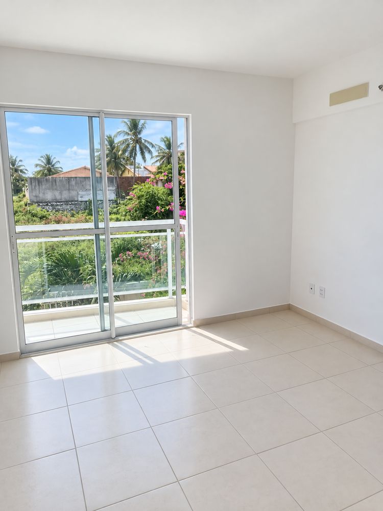 Espaço social do apartamento com ligação à varanda